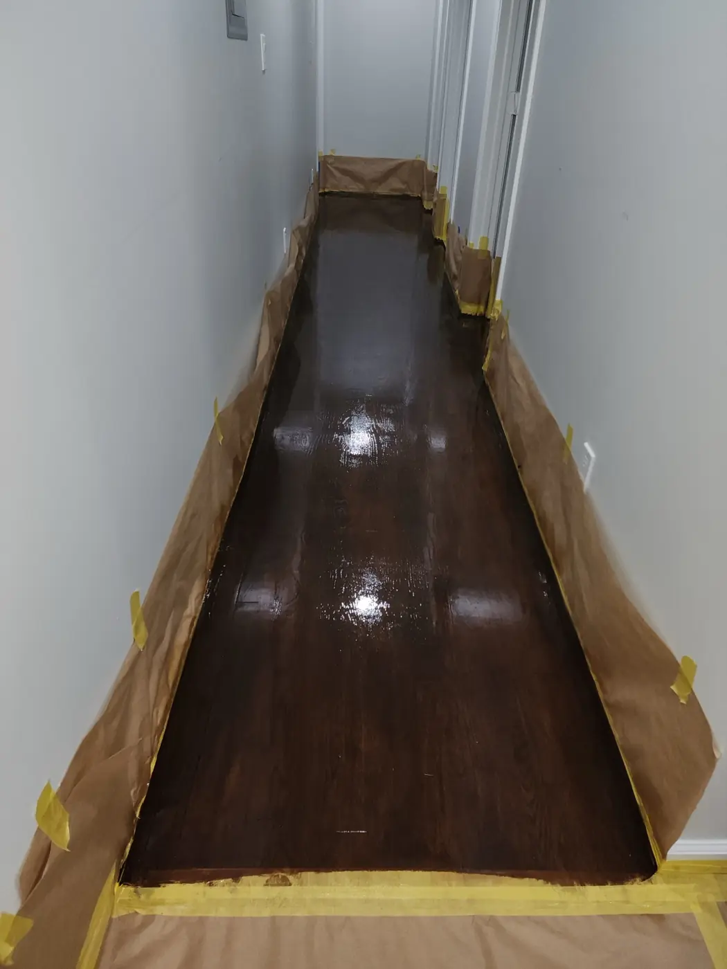 Hardwood floor finish: angled view showing the new color depth across the planks