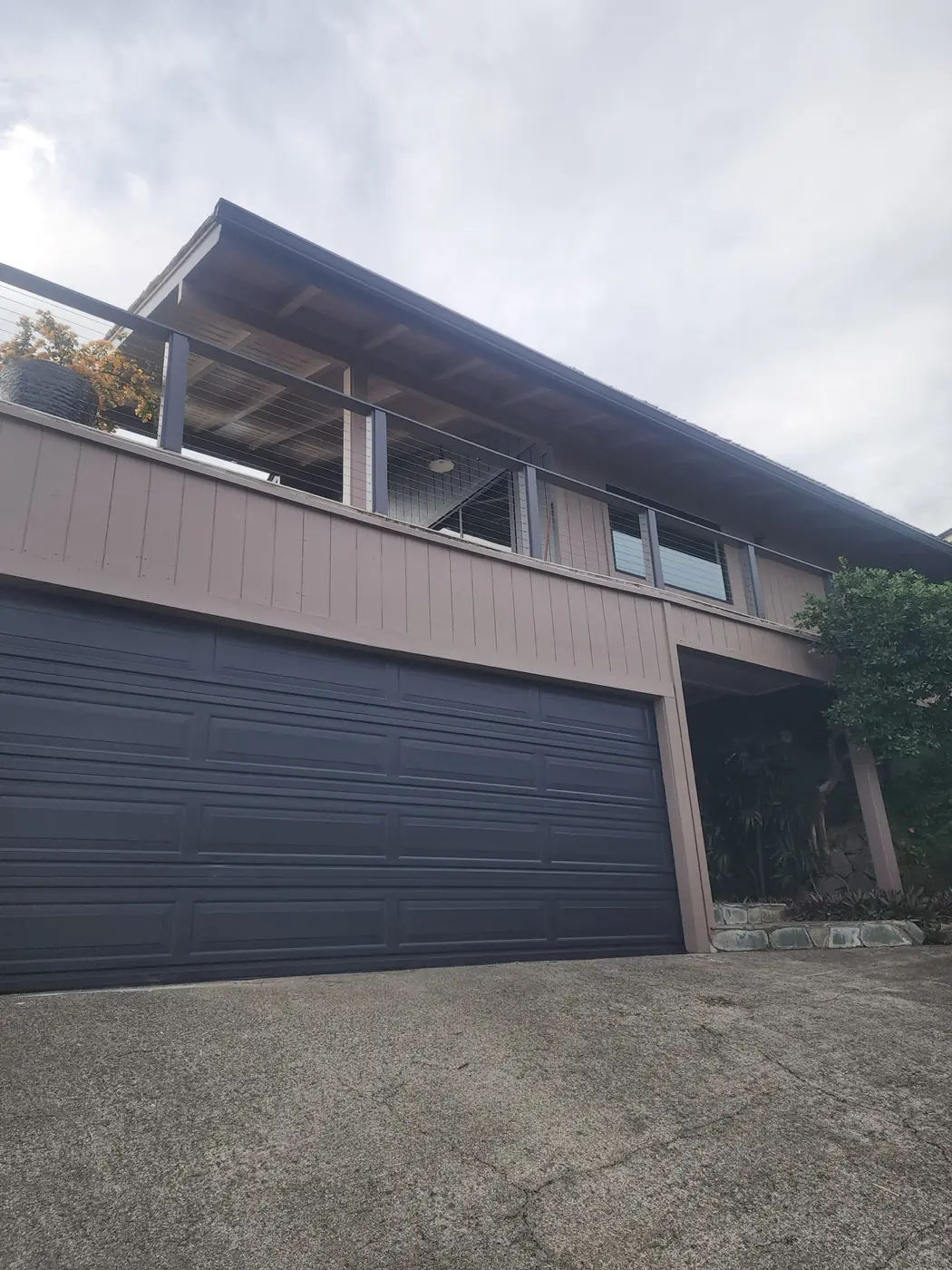 Hawaii Kai exterior: front elevation finished, white trim clean on the freshly painted siding