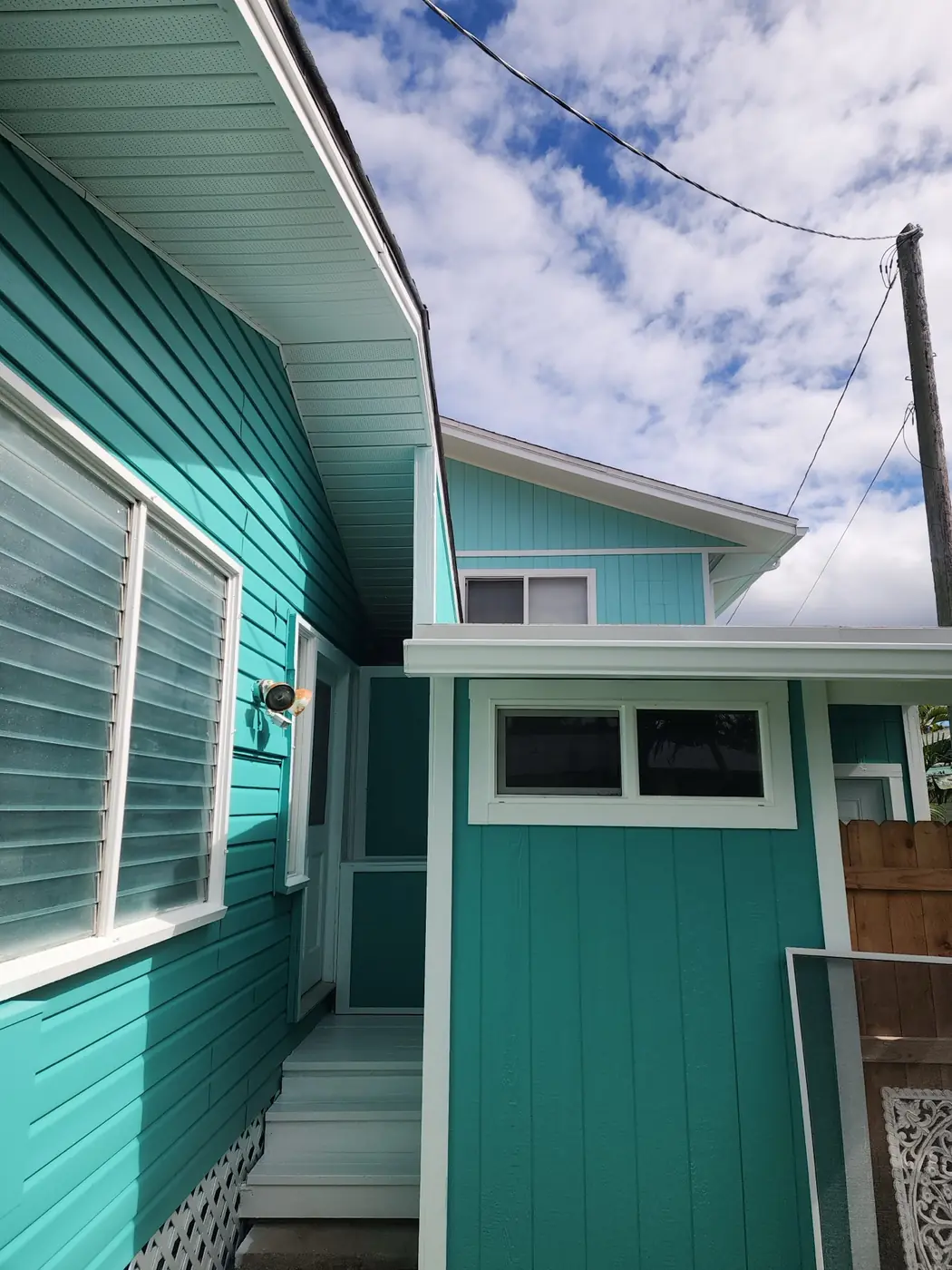 Kailua exterior: garage end finished in matching siding tone