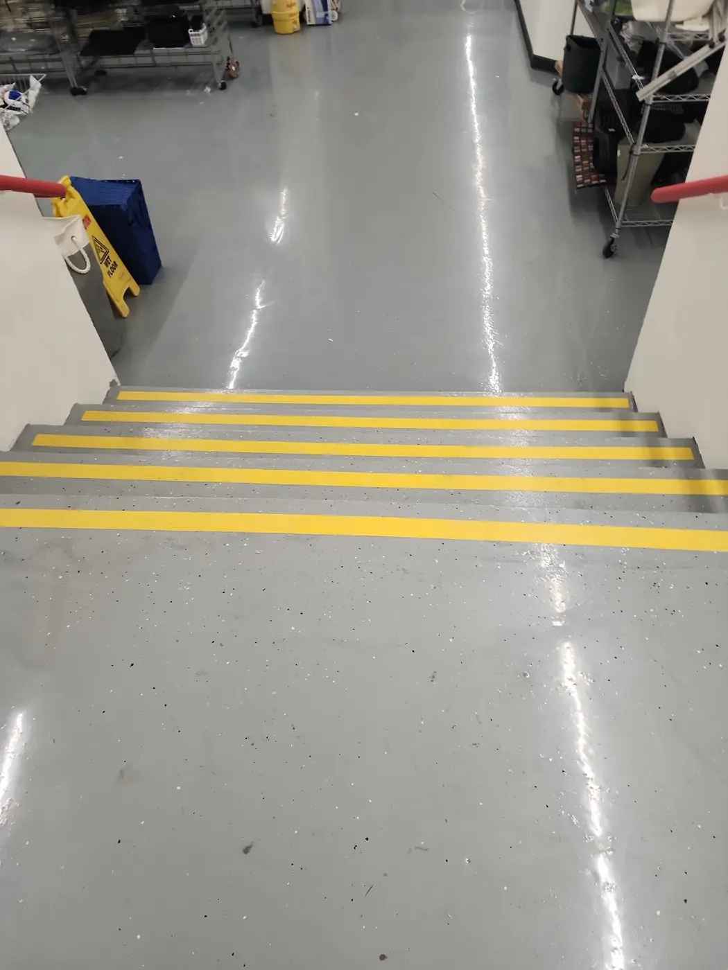 Salvation Army Kailua epoxy floor: angle on the finished surface with stockroom door visible